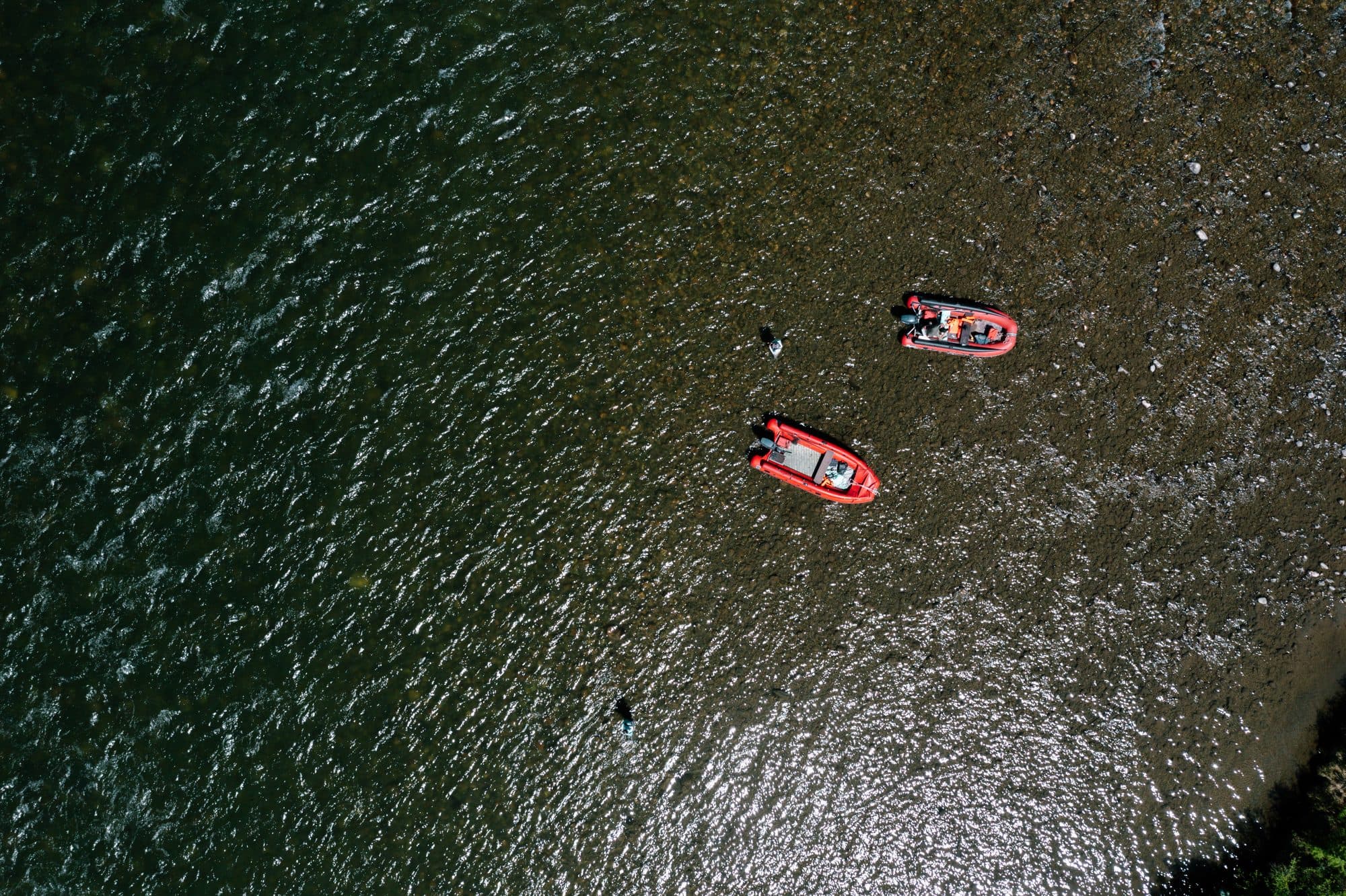 Aerial view of two rafts drifting down the taimen river